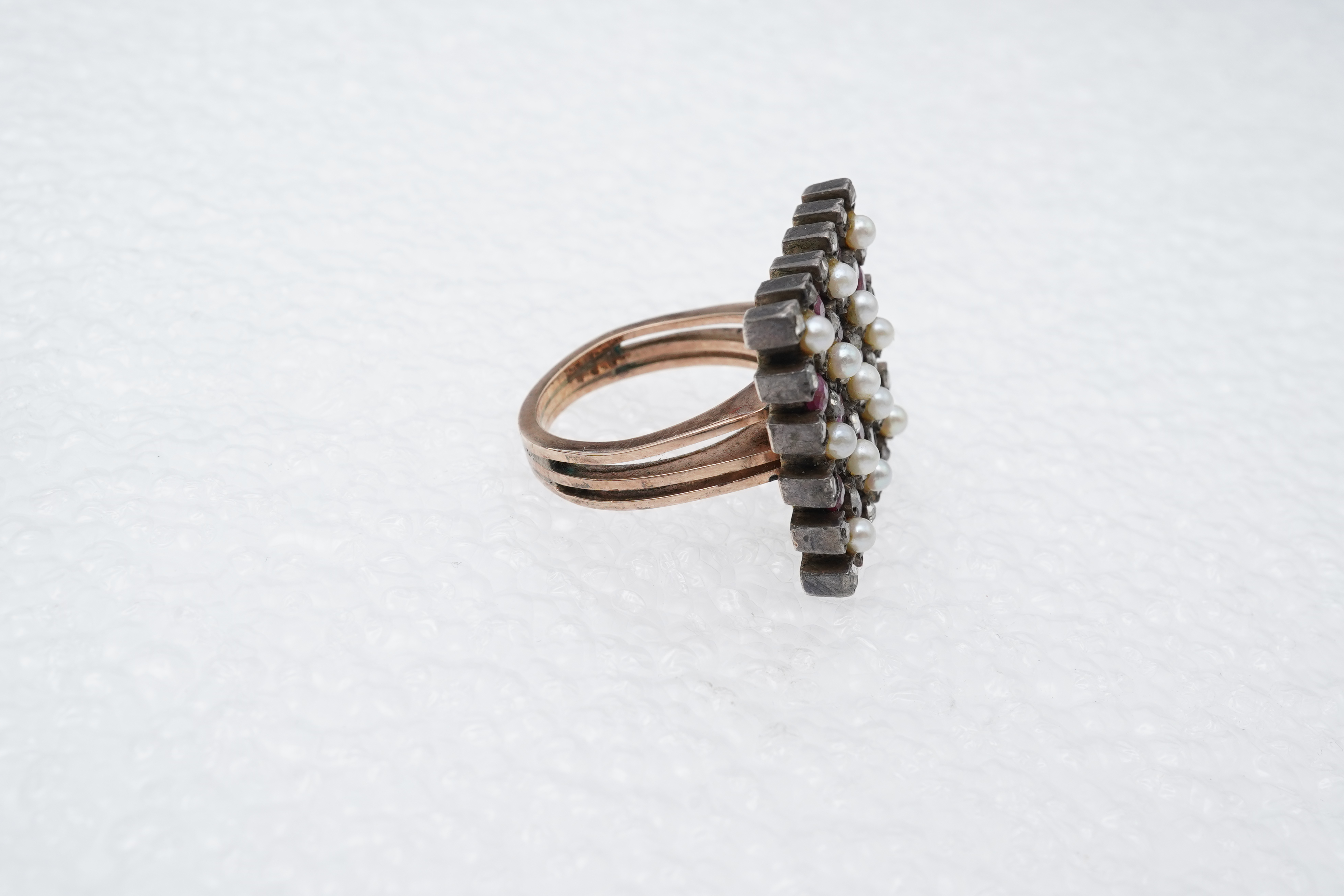 A synthetic ruby, seed pearl and diamond ring